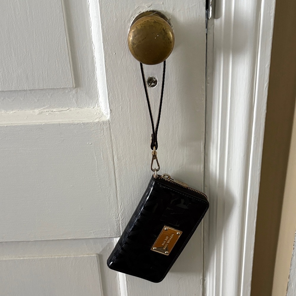 Michael Kors Black Wristlet with Gold Plate
